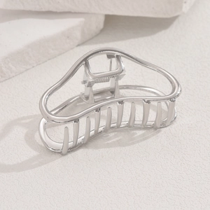 Polished silver metal hair claw clip with minimalist hollow geometric cloud design