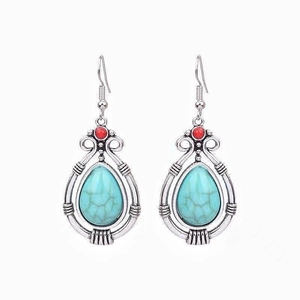 Bohemian vintage drop earrings with turquoise stones and red beads in antique silver finish