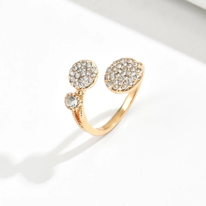 Elegant gold-plated adjustable ring with asymmetric white rhinestones on white background