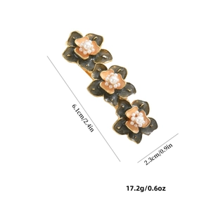 Elegant bronze daisy hair clip with orange-pink petals and white pearls, size 6.1cm