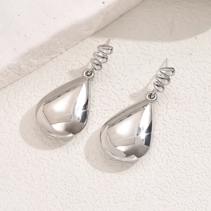 Elegant polished silver teardrop earrings with irregular beaded stud design