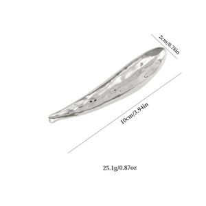 Lava-style silver metal hair clip with irregular waterdrop design and hammered texture