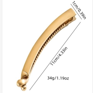 Elegant gold metal banana hair clip with brushed texture and twist design for women