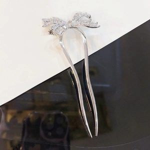 Elegant silver U-shaped hair fork with a zircon-encrusted bow design for hair styling