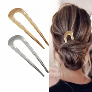 Minimalist U-shaped metal hair pins in gold and silver for elegant bun styling