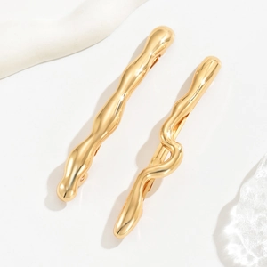 Barrettes à cheveux dorées minimalistes au design ondulé et finition métal poli