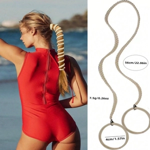 Detail of 56cm braided ponytail extension with ring attachment and beach style demo