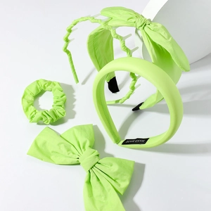 Neon green hair accessories set including bow headband, scrunchie and large hair clip