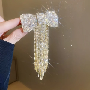 Barrette à cheveux élégante avec nœud en strass et longues franges scintillantes pour femmes