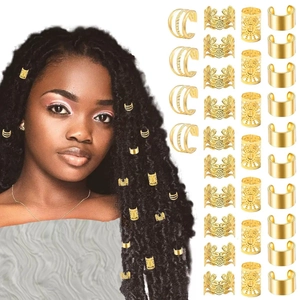 Detailed view of hollow golden alloy hair rings for braids in diverse engraved patterns
