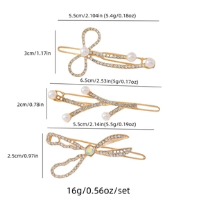 Dreiteiliges Set goldener Haarspangen mit Strass und Perlen in Schleifenform