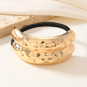 Minimalist elastic hair tie with textured gold hammered metal geometric charm detail