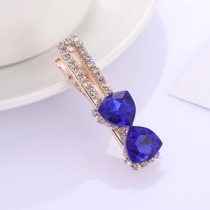 Barrette à cheveux or rose avec nœud en cristal bleu marine et strass brillant