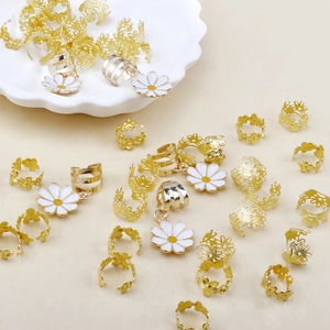 45-piece gold hair rings set with white daisy charms and filigree flower patterns