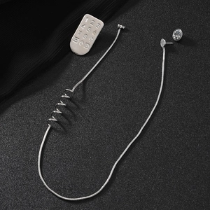 Silver snake chain earrings with numeric telephone keypad plate in a polished punk style