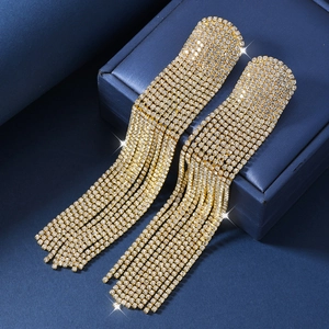 Elegant gold-tone tassel fringe earrings with shimmering full rhinestone pave for formal wear