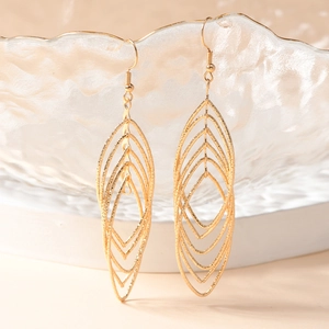 Gold layered leaf drop earrings with textured metallic finish and hook dangle style