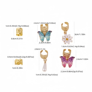 Bohemian gold hair cuffs and butterfly rings set with floral charms and pearls