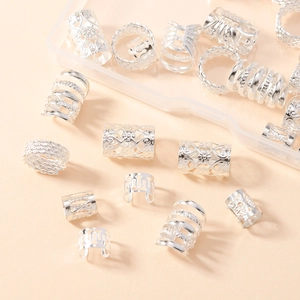 Detailed macro view of silver hollowed hair rings for dreadlocks and DIY braiding styles