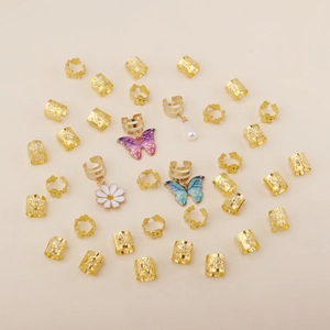 34-piece bohemian gold hair rings set with butterfly charms and faux pearls on white background