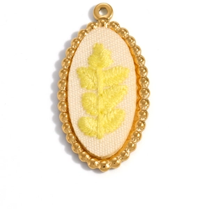 Oval 18K gold plated stainless steel pendant with yellow floral embroidery detail