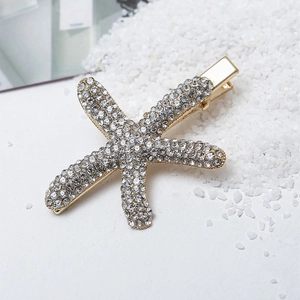 Elegante fermaglio per capelli a stella marina con strass su sfondo di pietre