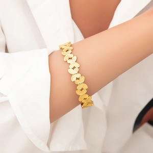 Elegant 18k gold plated stainless steel bracelet featuring textured butterfly link charms