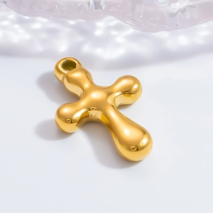 Pendentif croix en acier inoxydable doré poli avec un design de bulle liquide sur blanc