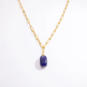 Close-up of 18k gold paperclip chain and oval dark blue stone pendant necklace