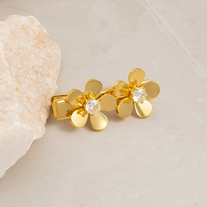 Detailed view of golden double flower hair clip with brilliant cubic zirconia inlays