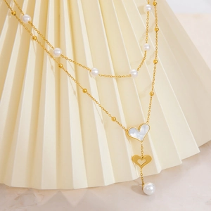 Double-layered 18k gold plated necklace with heart pendants and elegant pearls