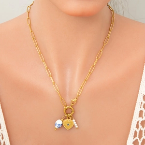 Golden paperclip chain necklace with heart pendant, blue ceramic bead and white pearls