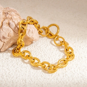 Detailed view of chunky 18k gold plated titanium chain bracelet with OT toggle clasp
