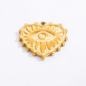 Detail of 18k gold heart-shaped pendant with evil eye engraving for DIY jewelry
