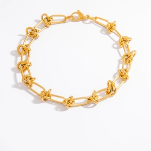 Detail view of 18k gold plated chain bracelet with knot links and lobster clasp