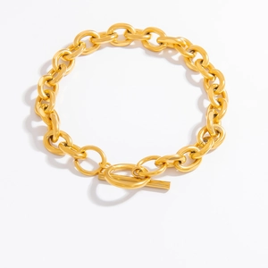 Detailed view of gold plated titanium link bracelet with classic T-bar toggle clasp