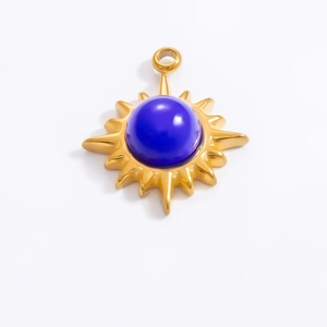 Detail of 18k gold plated sunburst evil eye pendant with blue resin and eye detail