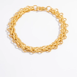Macro detail of 18k gold plated chain link bracelet with fine diamond-cut texture and clasp