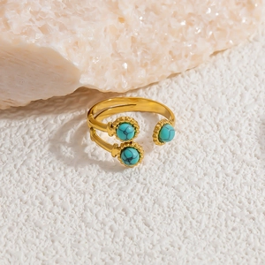 Detailed shot of gold plated adjustable ring featuring three turquoise stone accents