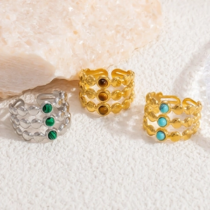 Detail of adjustable vintage natural stone rings with triple-layer wave dotted texture