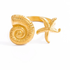 Detail of 18k gold open ring featuring intricate seashell and starfish nautical motifs