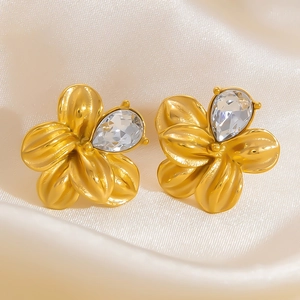 Detail of 18K gold plated flower earrings featuring large teardrop-shaped zircon crystals