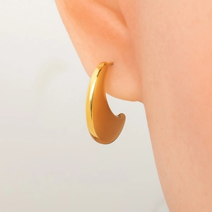 Macro detail of high-polished 18K gold plated minimalist drop earrings for women