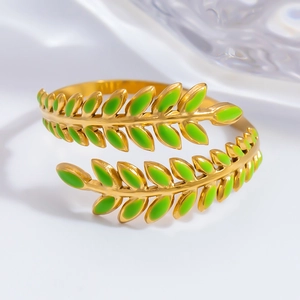Macro shot of 18K gold plated leaf ring with bright green enamel dripping oil detail