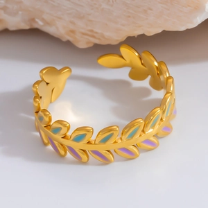Detail of 18K gold laurel leaf ring with purple and blue gradient enamel finish