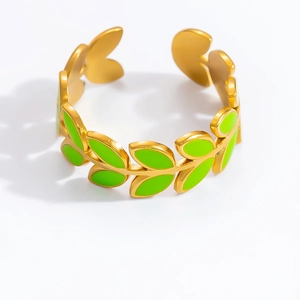 Detail of 18K gold plated leaf ring with vibrant green enamel and adjustable open design