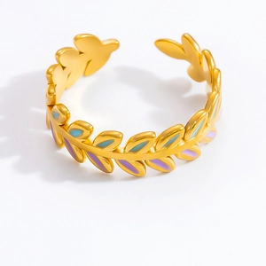 Close-up of 18K gold plated leaf ring with purple and blue enamel detailing