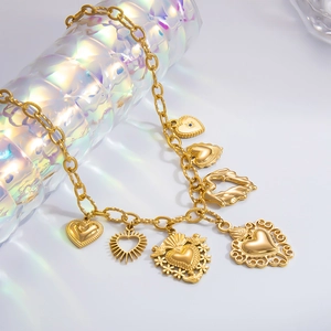 Close-up of golden chunky chain necklace featuring seven unique heart-shaped charms