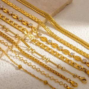Detail view of 18k gold plated stainless steel Cuban, snake, and diamond bean link chains
