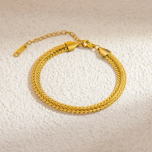 Detail of 18k gold plated stainless steel woven chain with lobster clasp and tag